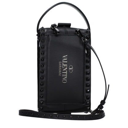 Small Clutch Handbag by Valentino Garavani for men in leather black features a sculptural silhouette with a secure zipper, ample external-pockets, and versatile shoulder-strap, adjustable-strap & handle for a sculptural finish.