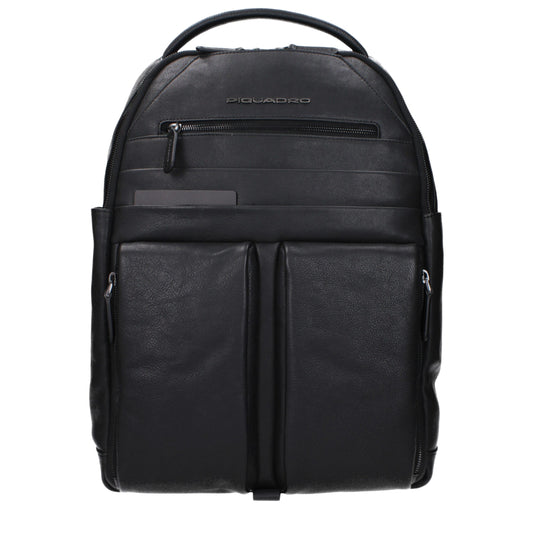 Large Backpack by Piquadro for men in faux patent leather black showcases a stately Faux Patent Leather Large Backpack design, featuring a secure zipper with stately built-in-compartments & external-pockets and versatile backpack-strap, adjustable-strap & handle.
