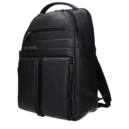 Large Backpack by Piquadro for men in faux patent leather black showcases an architectural Faux Patent Leather Large Backpack design, featuring a secure zipper, ample built-in-compartments & external-pockets, and architectural backpack-strap, adjustable-strap & handle for a sophisticated look.