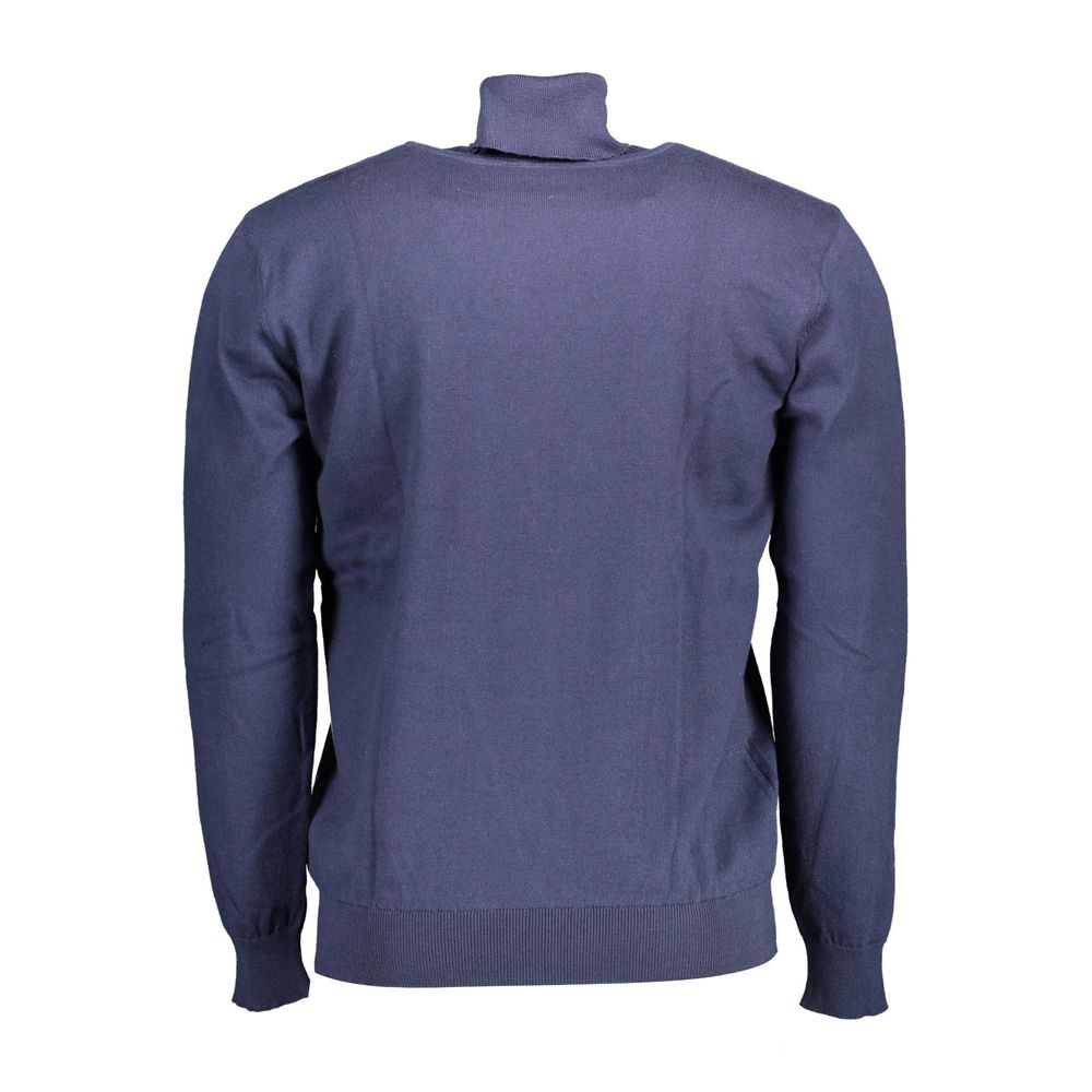 Sweater by U.S. POLO ASSN. for men in cotton blue showcases a sumptuous silhouette, artfully finished with a sumptuous turtle high-collar neckline and for a sophisticated, sumptuous look.