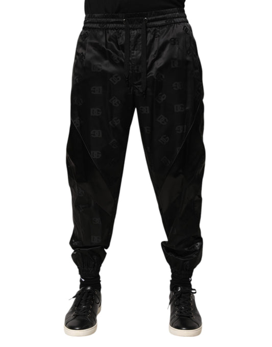 Jogger Sweatpants by Dolce & Gabbana for men in nylon black & print features a contemporary silhouette with , a contemporary , long hem, and for a premium, high-performance aesthetic.