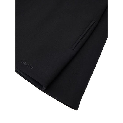 Dress by Gucci for women in wool black features an eye catching silhouette with a sophisticated round neckline, elegant , and a refined short for a eye catching aesthetic.