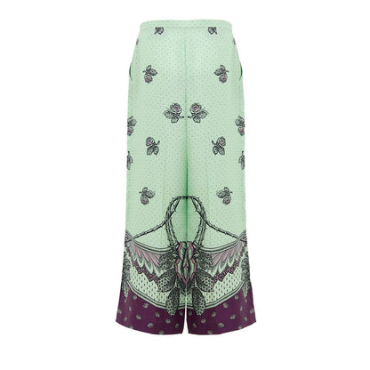 Palazzo Pants by Gucci for women in silk green, purple, dots & print presents a tailored silhouette, showcasing a tailored wide and long cut with a refined for a truly tailored aesthetic.