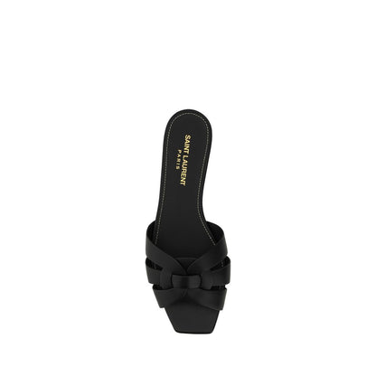 Sandals by Saint Laurent for women in bos taurus calfskin leather and black presents a captivating silhouette, showcasing the signature style of the Women's Bos Taurus Calfskin Leather Sandals with a captivating block-heel and captivating square toe style.