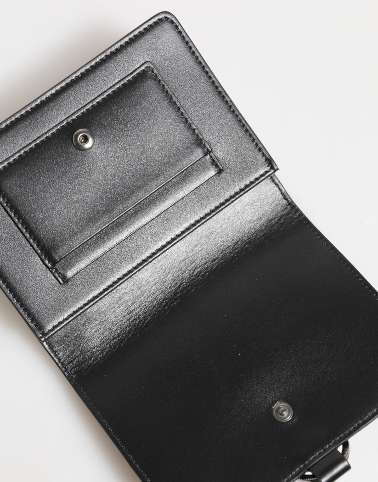 Cardholder Wallet by Dolce & Gabbana for women in brass crystal & calf leather black & silver showcases a refined silhouette, artfully detailed with the signature style of the Brass Crystal Calf Leather Cardholder Wallet and functional card-organization.