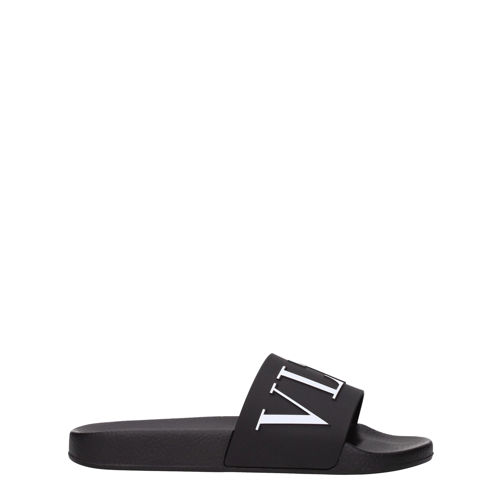 Flat Clogs Sandals by Valentino Garavani for men in cotton & rubber black showcases a sculptural silhouette as Men's Cotton & Rubber Flat Clogs Sandals, defined by a sculptural flat and sculptural open toe style for a sculptural look.