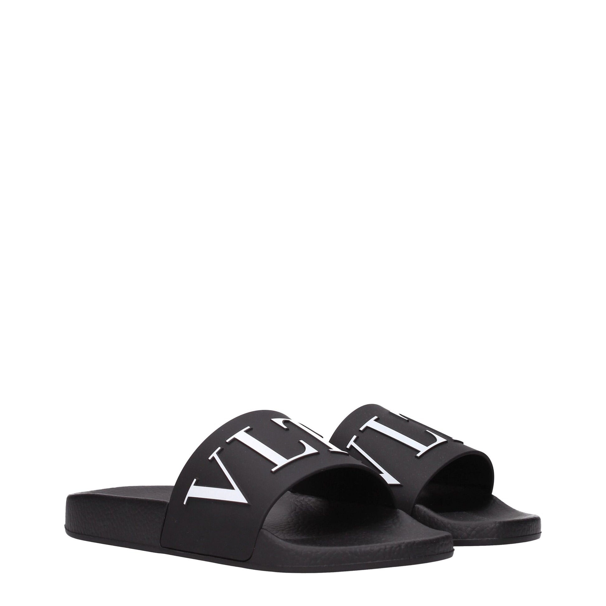 Flat Clogs Sandals by Valentino Garavani for men in cotton & rubber black features an statuesque Men's Cotton & Rubber Flat Clogs Sandals silhouette with a refined flat and elegant open toe style.