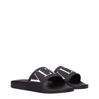 Flat Clogs Sandals by Valentino Garavani for men in cotton & rubber black features an statuesque Men's Cotton & Rubber Flat Clogs Sandals silhouette with a refined flat and elegant open toe style.