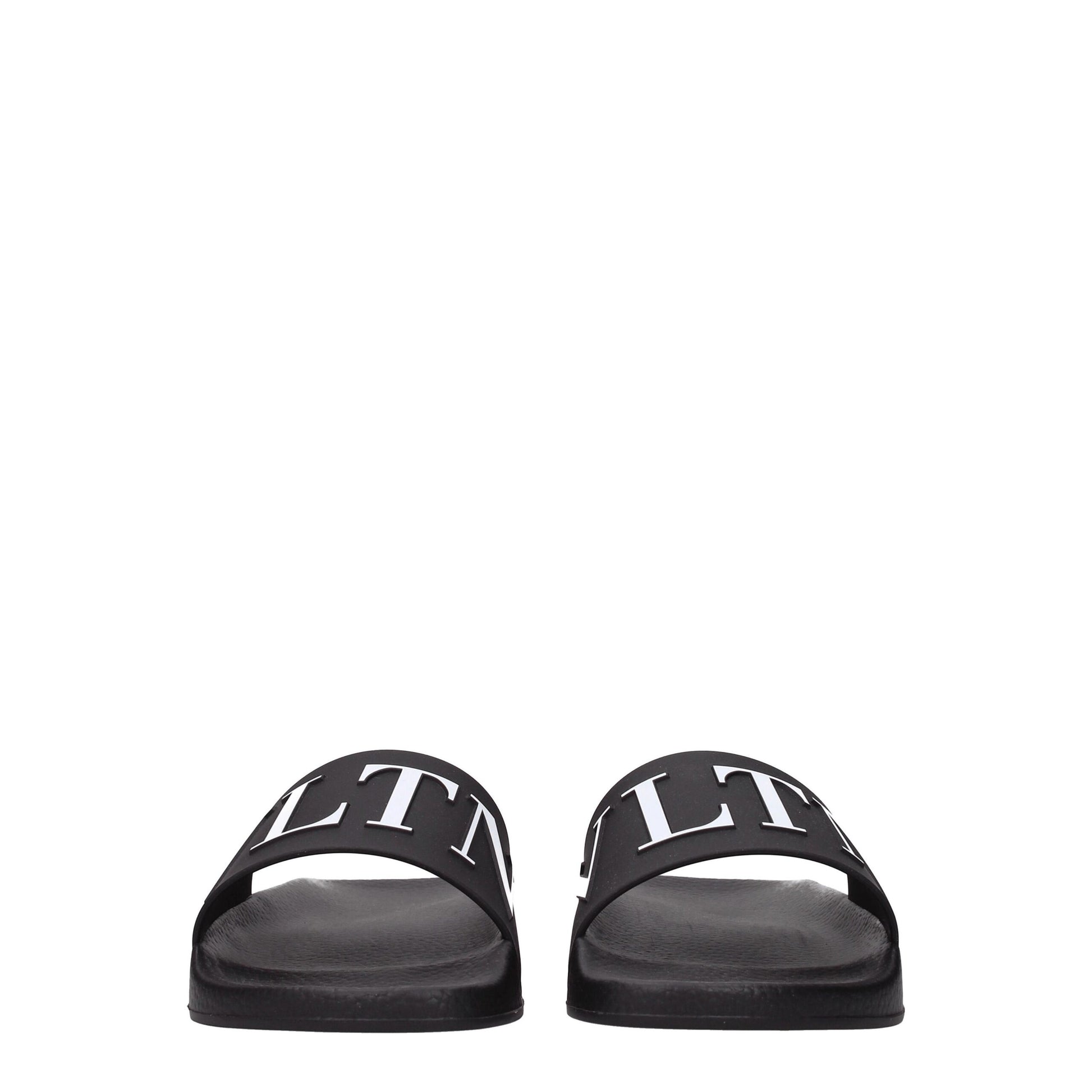 Flat Clogs Sandals by Valentino Garavani for men in cotton & rubber black features an exquisite silhouette, showcasing the exquisite Men's Cotton & Rubber Flat Clogs Sandals with a flat and open toe style.