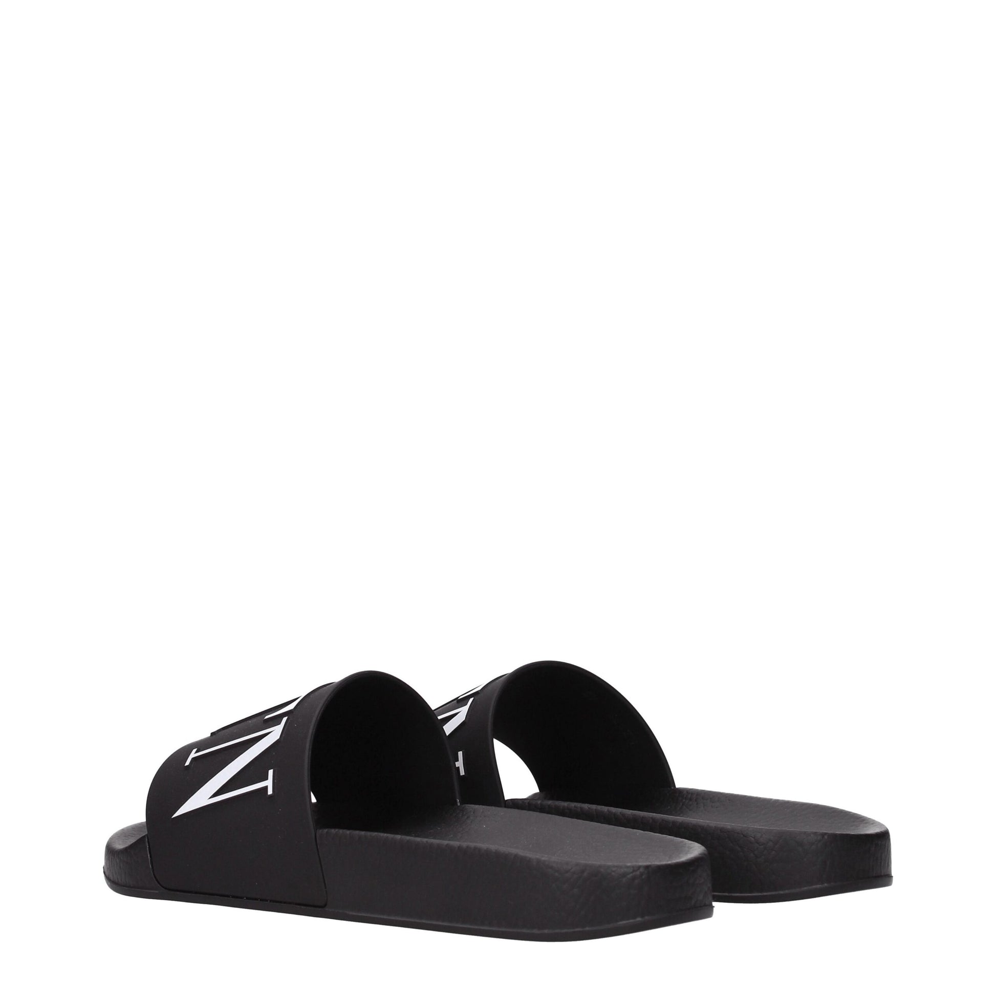 Flat Clogs Sandals by Valentino Garavani for men in cotton & rubber and black presents a captivating silhouette, showcasing the signature style of the Men's Cotton & Rubber Flat Clogs Sandals with a captivating flat and captivating open toe style.