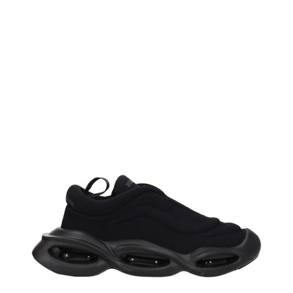 Sneakers by Dolce & Gabbana for men in rubber & fabric black presents a impeccable silhouette as Men's Chunky Rubber & Fabric Sneakers, expertly defined by a impeccable chunky style for a impeccable, high-fashion look.