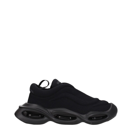 Sneakers by Dolce & Gabbana for men in rubber & fabric black presents a impeccable silhouette as Men's Chunky Rubber & Fabric Sneakers, expertly defined by a impeccable chunky style for a impeccable, high-fashion look.