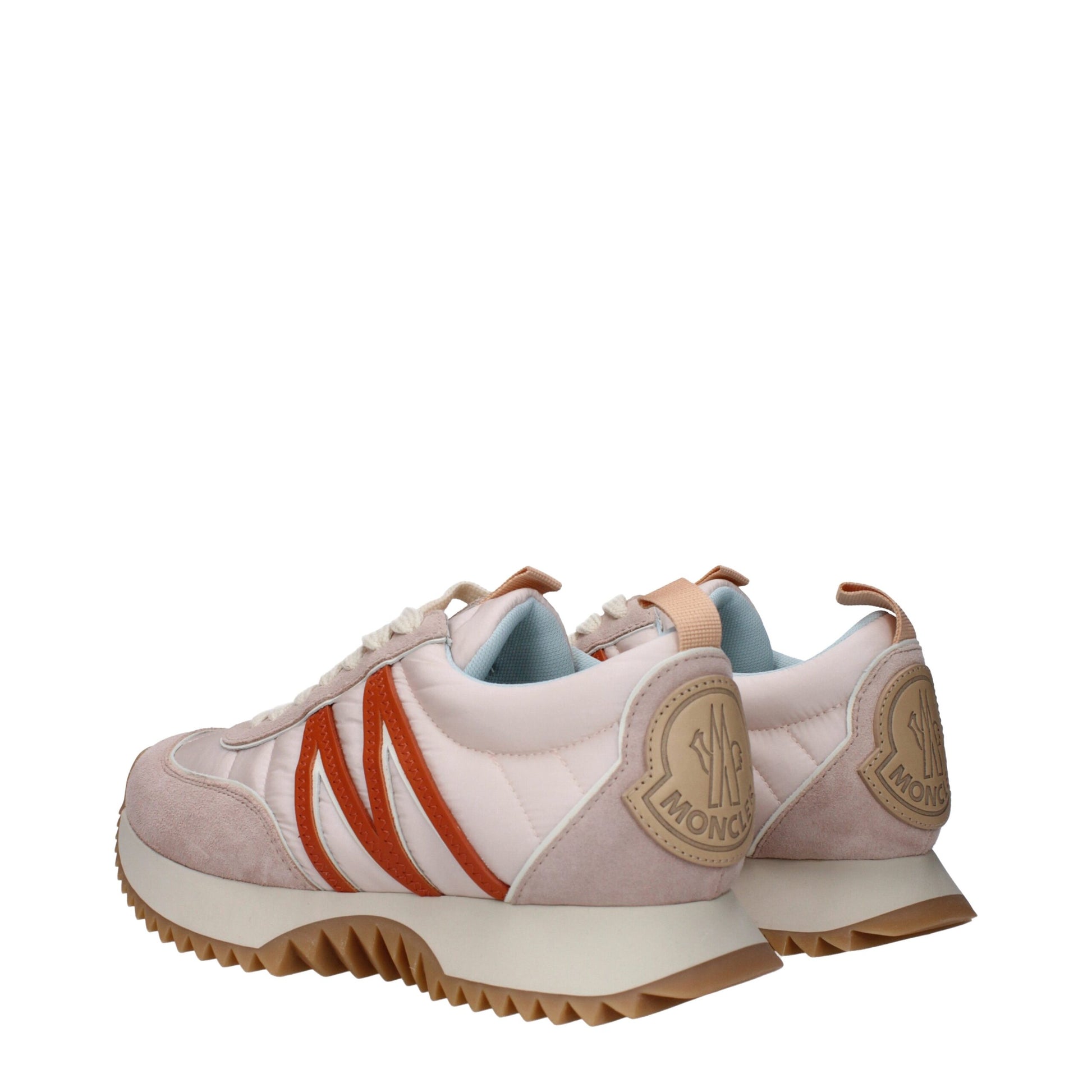Sneakers by Moncler for women in rubber & fabric pink presents a sumptuous silhouette, artfully capturing the essence of the Women's Chunky Rubber & Fabric Sneakers with its sumptuous chunky style design.