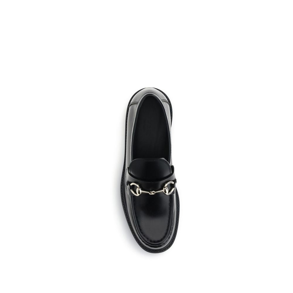 Loafer Loafers Slip-On Shoes by Gucci for women in bos taurus calf leather black features an timeless silhouette, showcasing the Horsebit Women's Bos Taurus Calf Leather Loafer Loafers Slip-On Shoes design with an timeless block-heel and a round toe style for a timeless look.