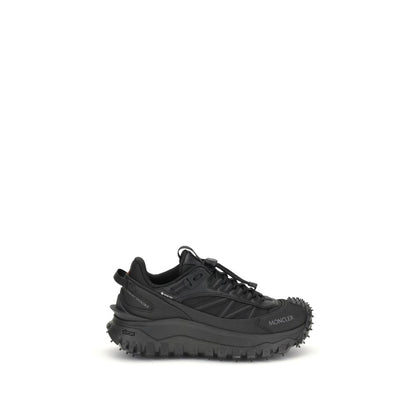 Athletic Sneakers by Moncler for women in bos taurus calf leather & polyester black & print showcases a architectural silhouette, artfully capturing the essence of the Women's Low Top Bos Taurus Calf Leather & Polyester Athletic Sneakers with its signature architectural low-top style construction.