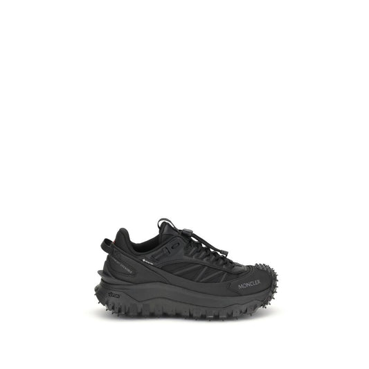 Athletic Sneakers by Moncler for women in bos taurus calf leather & polyester black & print showcases a architectural silhouette, artfully capturing the essence of the Women's Low Top Bos Taurus Calf Leather & Polyester Athletic Sneakers with its signature architectural low-top style construction.