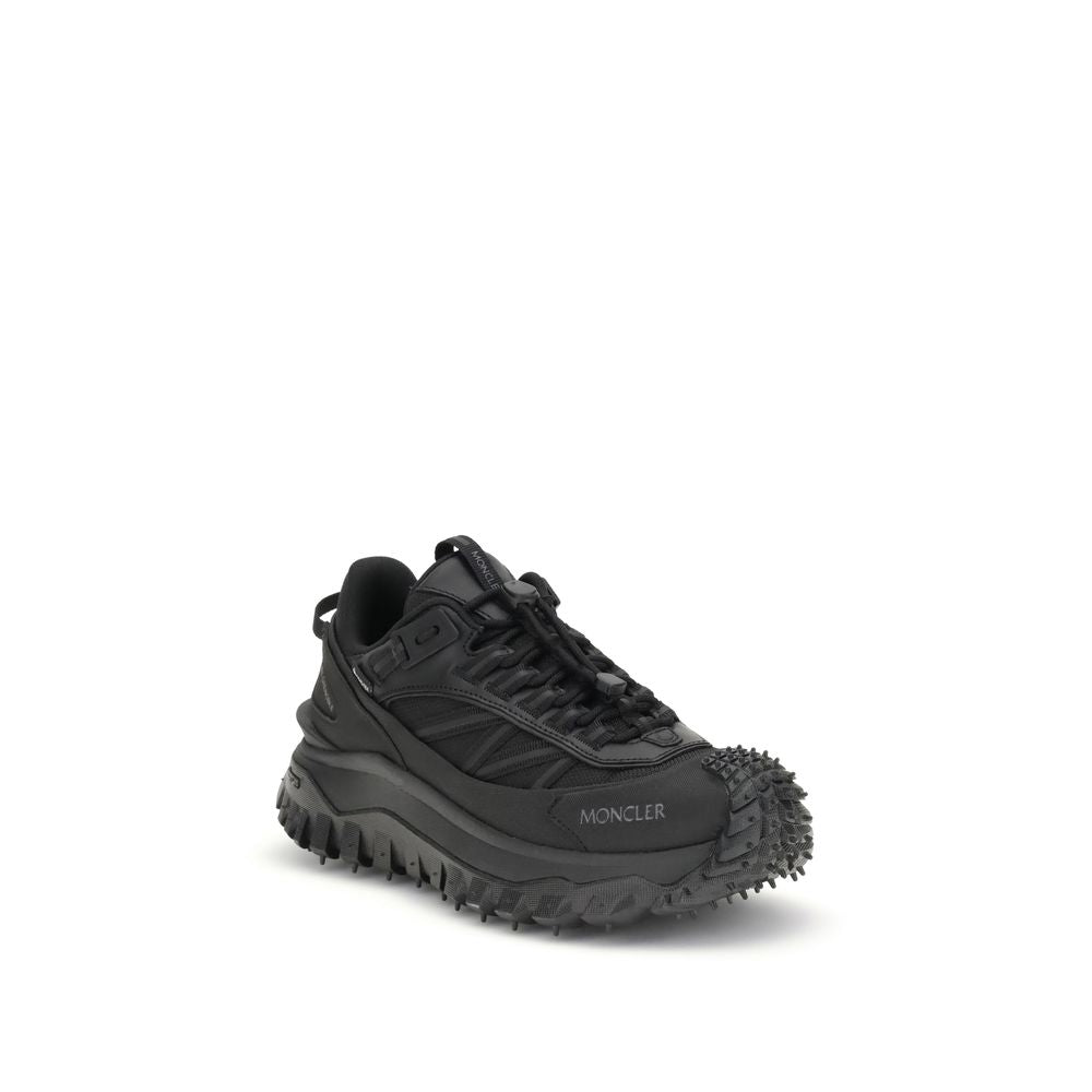 Athletic Sneakers by Moncler for women in black & print features an architectural silhouette, showcasing the premium low-top style of the Women's Low Top Bos Taurus Calf Leather & Polyester Athletic Sneakers with an architectural finish.