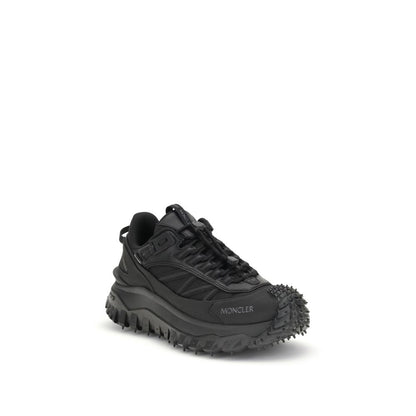 Athletic Sneakers by Moncler for women in black & print features an architectural silhouette, showcasing the premium low-top style of the Women's Low Top Bos Taurus Calf Leather & Polyester Athletic Sneakers with an architectural finish.