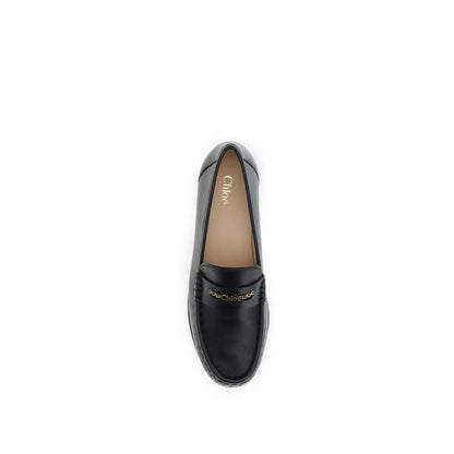 Loafer Shoes by Chloé for unisex in bos taurus calfskin leather black & gold features an ergonomic silhouette, perfectly showcasing Unisex Bos Taurus Calfskin Leather Loafer Shoes with its distinct and elegant .