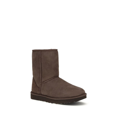 Boots by UGG for women in suede leather & rubber brown features an aerodynamic silhouette from the Women's Suede Leather & Rubber Boots collection, showcasing a aerodynamic and refined for an aerodynamic look.