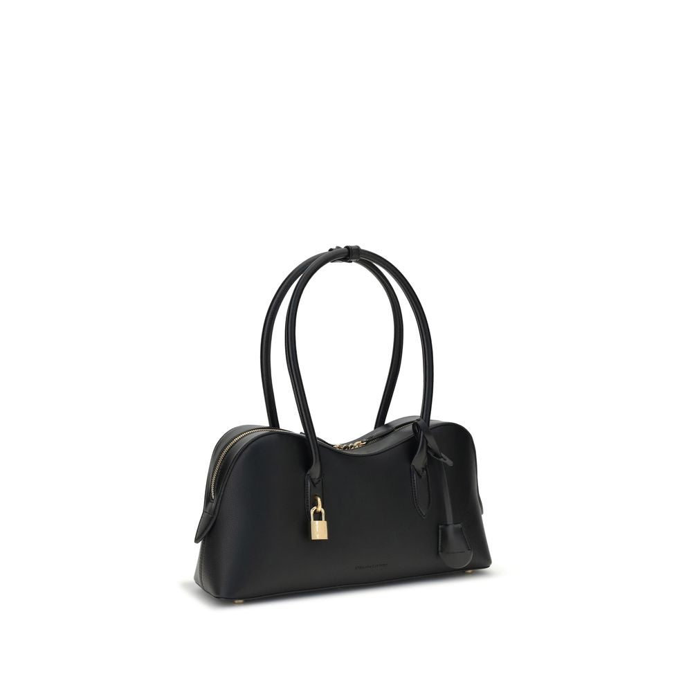Medium Shoulder Bag by Stella McCartney for women in leatherette black features an effortlessly chic silhouette with a secure , ample , and versatile shoulder-strap & handle for effortlessly chic everyday luxury.