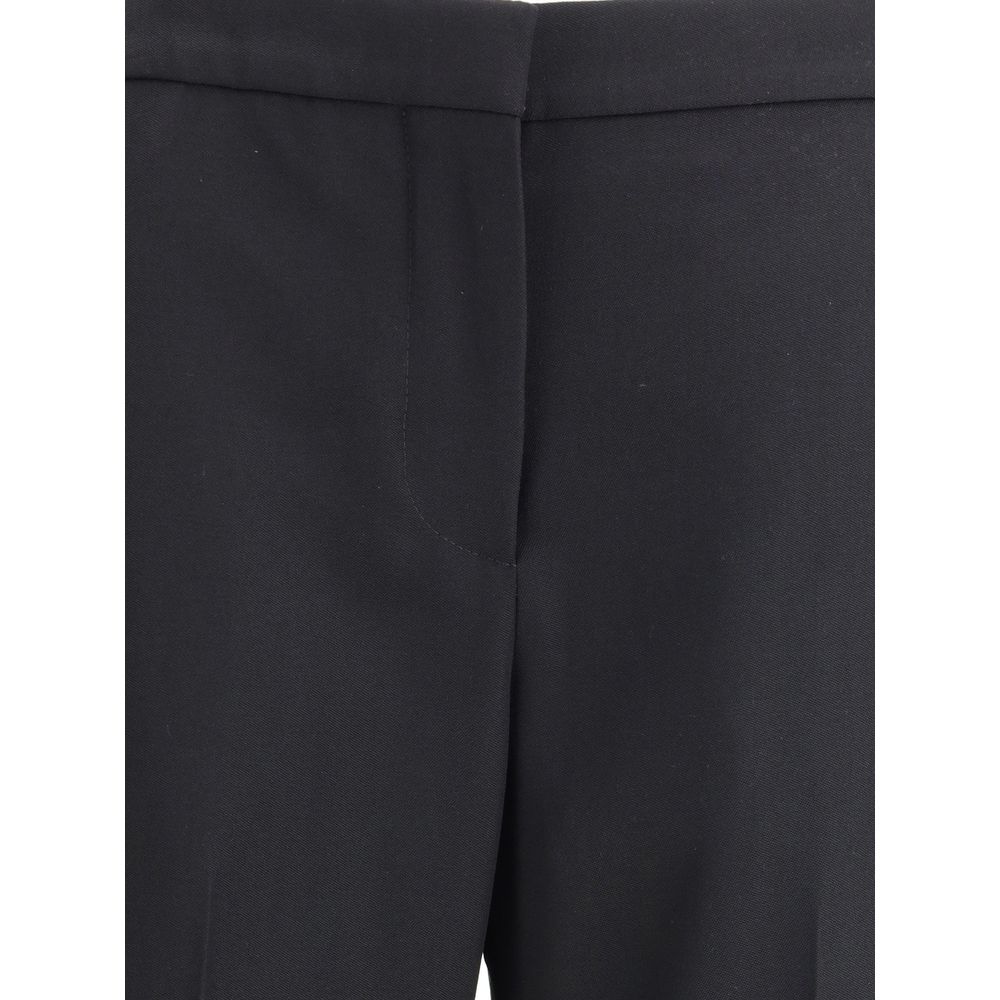 Pants by Givenchy for women in wool black features a utilitarian bootcut & regular-fit with a utilitarian long and to create a sophisticated, premium look.