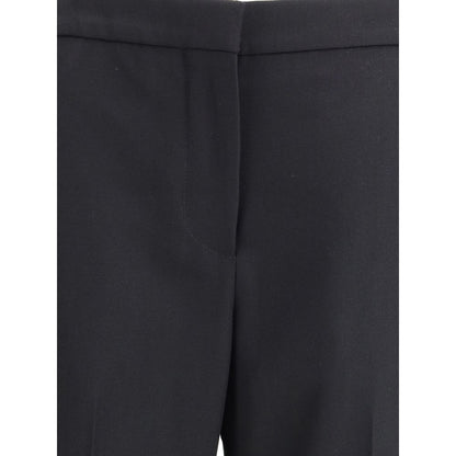 Pants by Givenchy for women in wool black features a utilitarian bootcut & regular-fit with a utilitarian long and to create a sophisticated, premium look.
