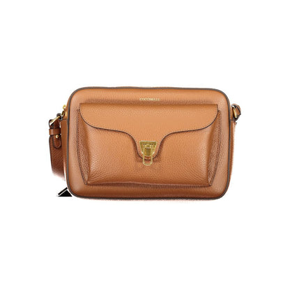 Handbag by Coccinelle for women in leather & metal brown & signature features a signature silhouette, showcasing a secure zipper and signature external-pockets & internal-pockets with versatile shoulder-strap & adjustable-strap for a sophisticated look.