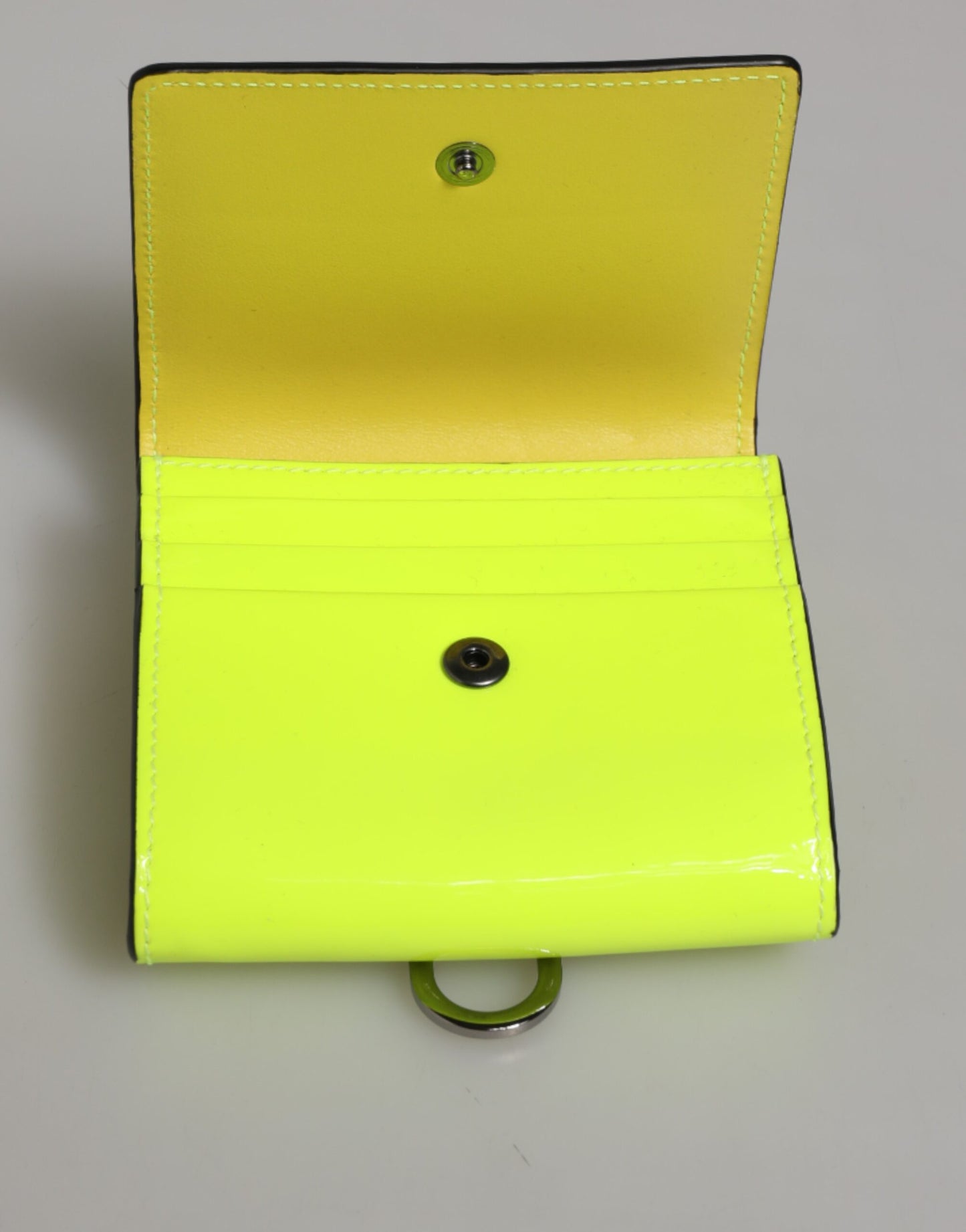 Cardholder Wallet by Dolce & Gabbana for men in calf leather green & yellow presents a streamlined silhouette, showcasing the sophisticated design of the Calf Leather Cardholder Wallet collection with functional card-organization bifold.