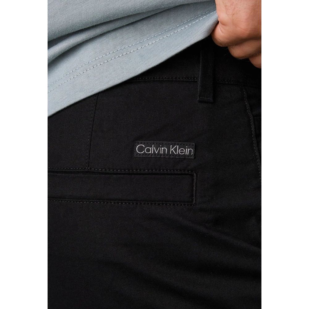 Pants by Calvin Klein Jeans for men in stretch cotton black features a enduring silhouette, showcasing a enduring tapered-leg & regular-fit and long with a for a premium, tailored aesthetic.