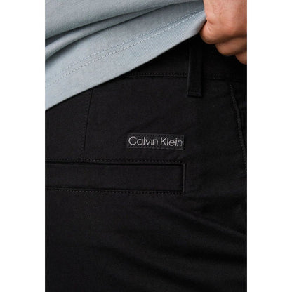 Pants by Calvin Klein Jeans for men in stretch cotton black features a enduring silhouette, showcasing a enduring tapered-leg & regular-fit and long with a for a premium, tailored aesthetic.