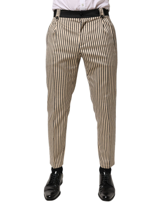 Trousers by Dolce & Gabbana for men in stretch cotton beige, black & striped presents a perennial silhouette, meticulously tailored with a tapered-leg, slim & cropped cut, cropped finish, and an elegant .
