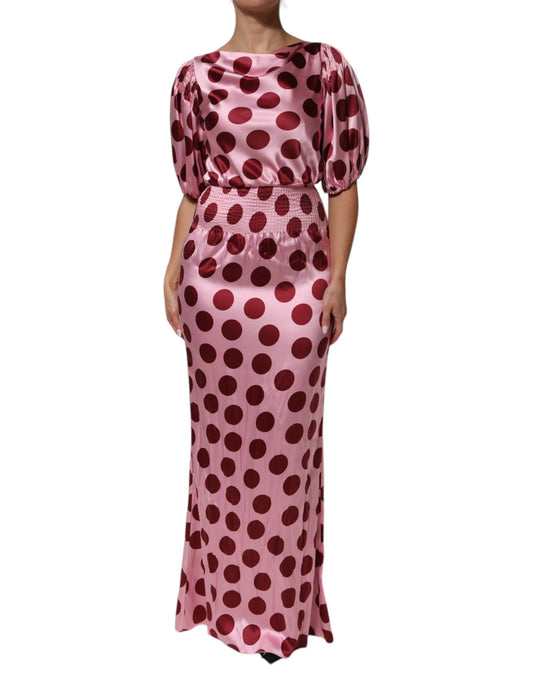 Dress by Dolce & Gabbana for women in silk satin pink, red, dots & patterned showcases a striking silhouette, elegantly detailed with a short-sleeve, refined boat neckline, and a striking maxi long for a striking finish.