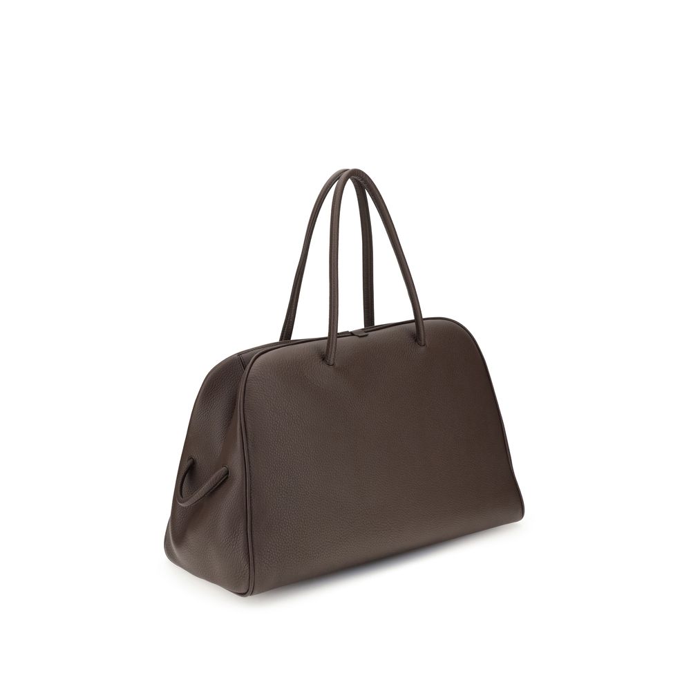 large Travel Bowling Handbag by Jacquemus for women in bos taurus calf grained leather brown & signature features a contemporary silhouette, showcasing a secure zipper, ample , and contemporary for a sophisticated look.
