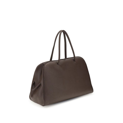 large Travel Bowling Handbag by Jacquemus for women in bos taurus calf grained leather brown & signature features a contemporary silhouette, showcasing a secure zipper, ample , and contemporary for a sophisticated look.