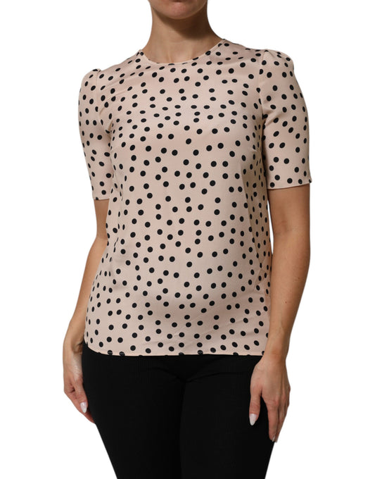 Blouse by Dolce & Gabbana for women in silk beige, black, patterned, dots & print showcases a sleek silhouette, elegantly detailed with a sleek round neckline and short-sleeve for a sleek finish.