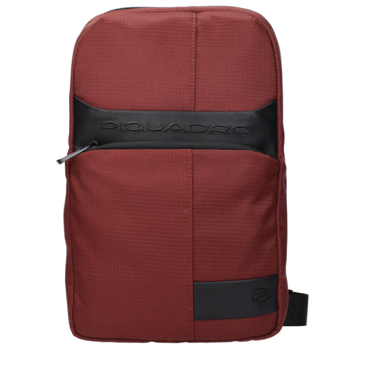 Crossbody Handbag by Piquadro for unisex in fabric red features a transformative elegance silhouette, showcasing a secure , organized , and versatile crossbody-strap & adjustable-strap for a transformative elegance look.