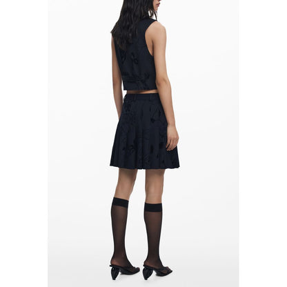 Skirt by Desigual for women in stretch viscose polyester black showcases a sultry silhouette, elegantly defined by its short mini and the sophisticated sultry design of the Women's Stretch Viscose Polyester Skirt.