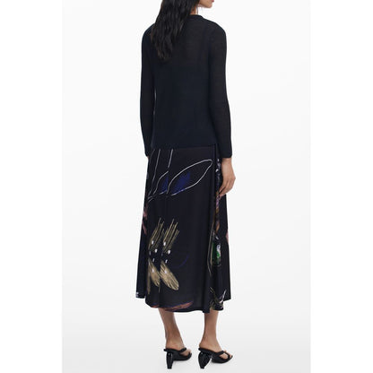 Dress by Desigual for women in stretch polyester black & signature features a dramatic silhouette, showcasing an elegant and that flows into a dramatic long.