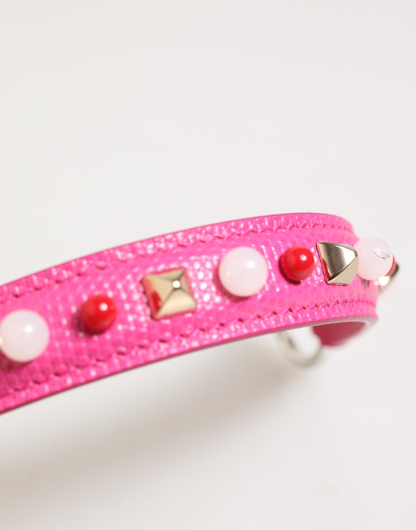 Shoulder Strap by Dolce & Gabbana for women in calf leather gold, pink, red, silver & white features a dynamic silhouette, artfully enhancing the dynamic design of this Calf Leather Shoulder Strap.