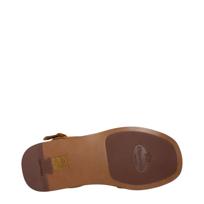 Flat Sandals by Church's for women in suede leather brown showcases a sculptural silhouette as Women's Suede Leather Flat Sandals, defined by a sculptural flat and sculptural for a sculptural look.