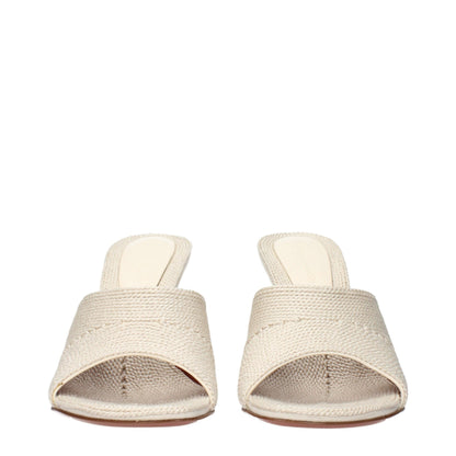 Slippers by Amina Muaddi for women in fabric beige presents a sumptuous silhouette, perfectly capturing the sumptuous essence of Women's Fabric Slippers with its signature and .