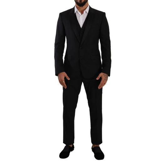 Pant Suit by Dolce & Gabbana for men in virgin wool cupro & silk black showcases an bespeak silhouette, artfully detailed with a sophisticated single-breasted neckline and an bespeak slim for a refined finish.