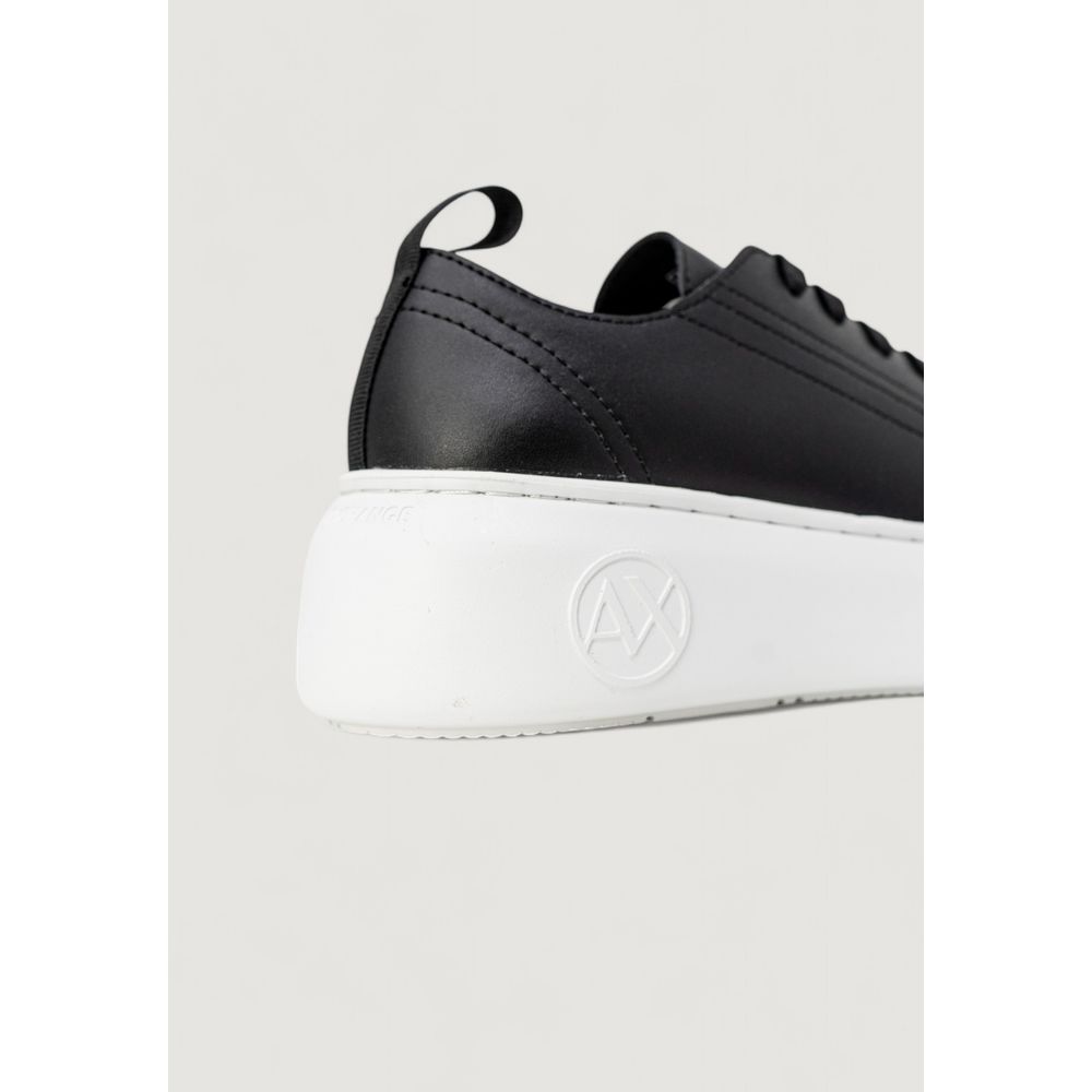 Sneakers by Armani Exchange for women in leather & rubber black presents a sumptuous silhouette from the Women's Low-Top Casual Leather & Rubber Sneakers collection, showcasing a sumptuous low-top casual style for an elevated aesthetic.