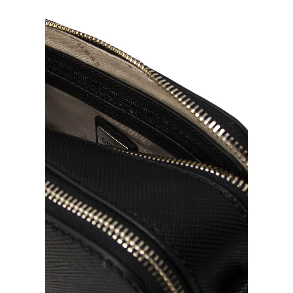 Small Crossbody Camera Handbag by Guess for women in polyethylene & polyurethane black features an refined silhouette, showcasing a secure , ample , and versatile crossbody-strap, shoulder-strap & adjustable-strap for a sophisticated refined aesthetic.