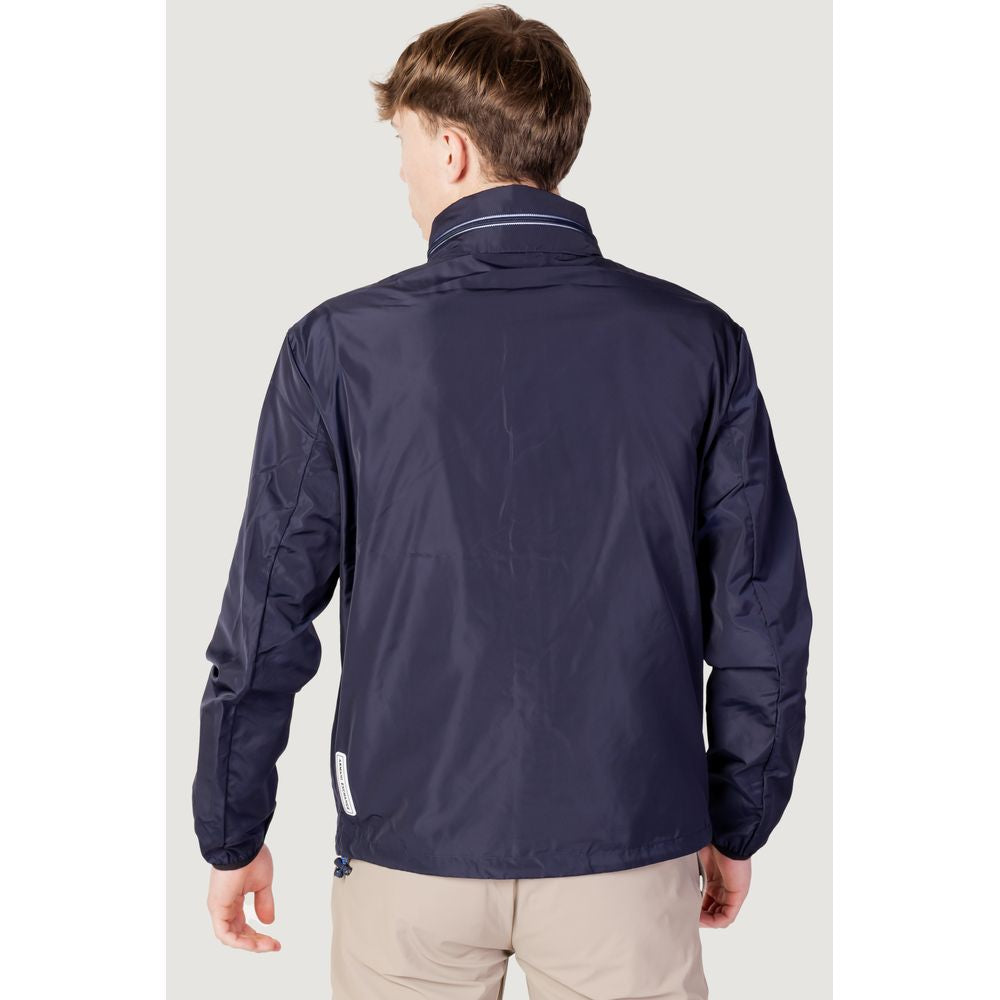 Windbreaker Jacket by Armani Exchange for men in polyester blue presents a resilient silhouette, artfully detailed with a sophisticated and functional lightweight, pockets & windproof for a resilient finish.