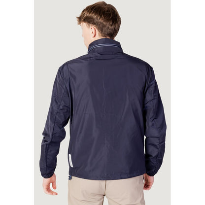 Windbreaker Jacket by Armani Exchange for men in polyester blue presents a resilient silhouette, artfully detailed with a sophisticated and functional lightweight, pockets & windproof for a resilient finish.