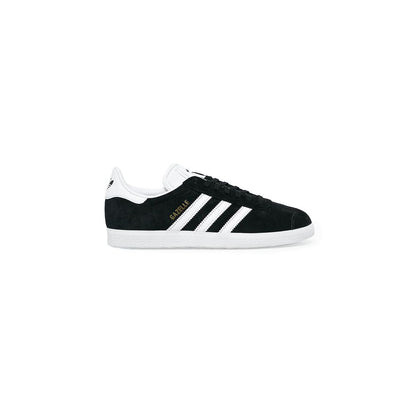 Sneakers by Adidas Originals for women in leather & rubber black features a sumptuous design, perfectly showcasing the sumptuous low-top casual style of this Women's Low-Top Casual Leather & Rubber Sneakers.