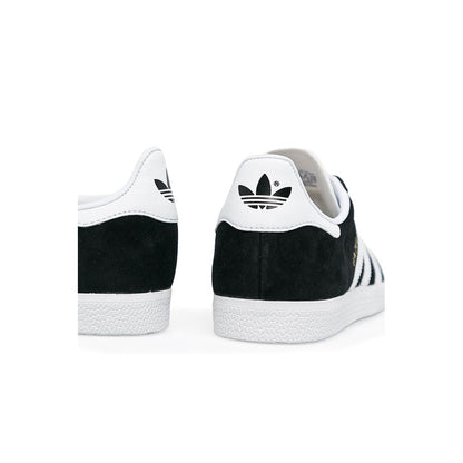 Sneakers by Adidas Originals for women in leather & rubber black presents a sumptuous silhouette as Women's Low-Top Casual Leather & Rubber Sneakers, expertly defined by a sumptuous low-top casual style for a sumptuous, high-fashion look.