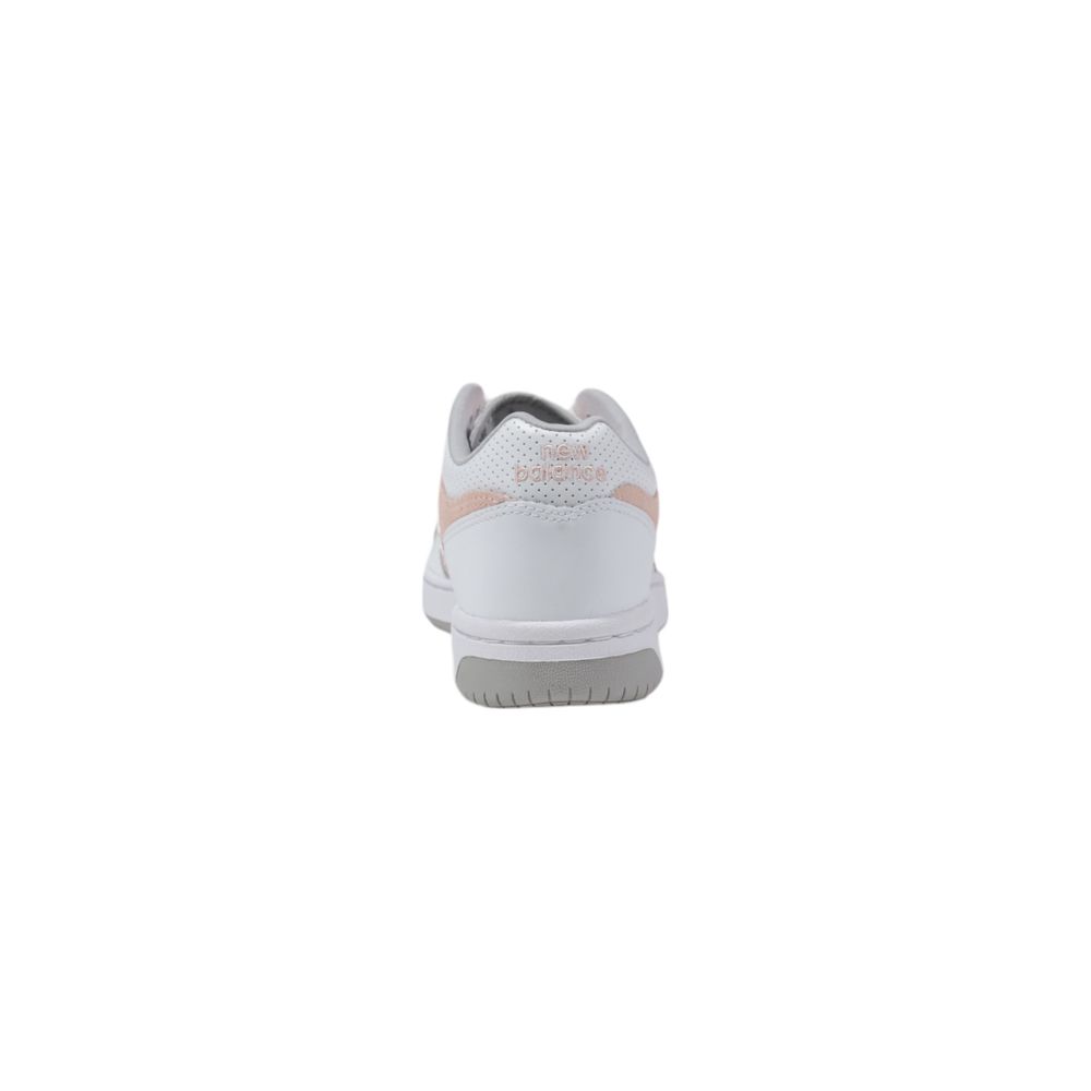 Sneakers by New Balance for women in leather & rubber pink presents a sumptuous silhouette from the Women's Low-Top Casual Leather & Rubber Sneakers collection, showcasing a sumptuous low-top casual style for an elevated aesthetic.
